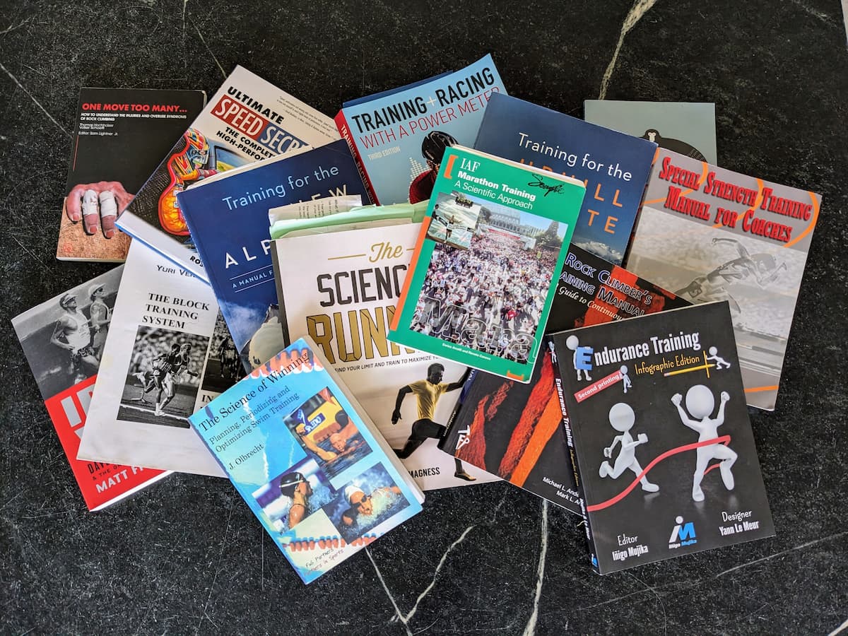 A photograph of a pile of books about training from a variety of different sports