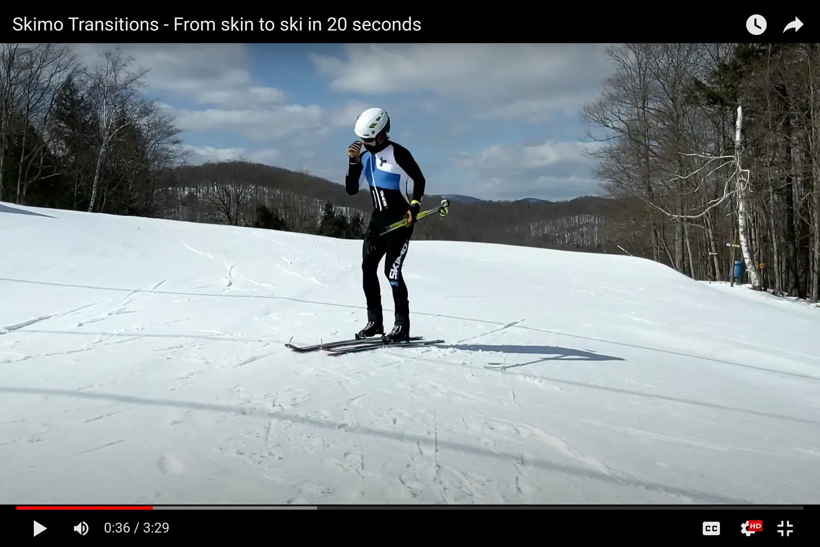 An image of a skimo racer entering a transition zone and unzipping their suit